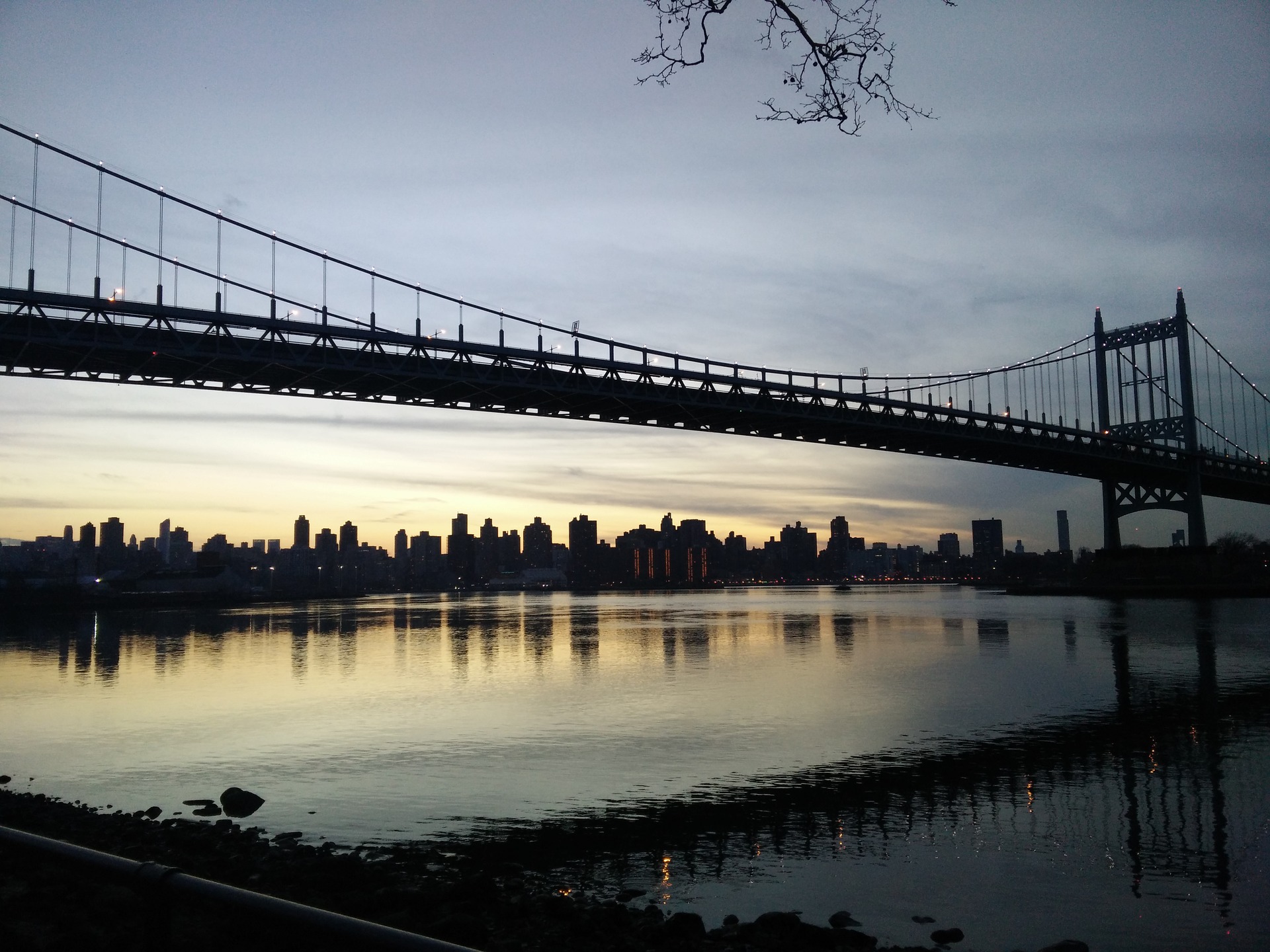 From a bench in Astoria Park, one can look past the Kennedy Bridge and see the Manhattan skyline.